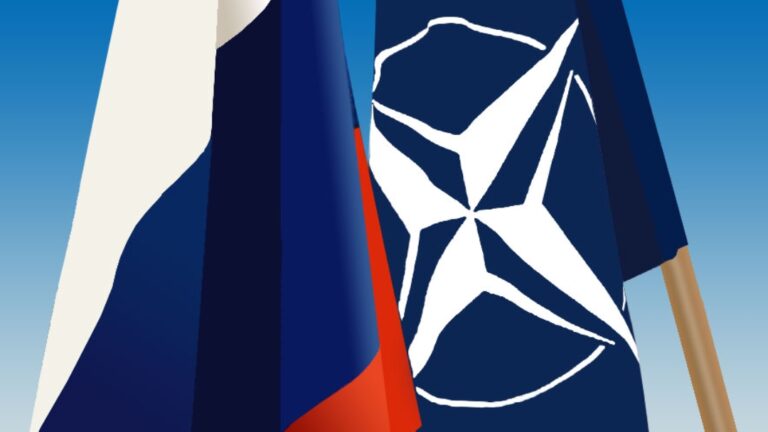 Bandiere di Russia e NATO a confronto, simbolo delle tensioni geopolitiche e del rischio di una guerra europea imminente
